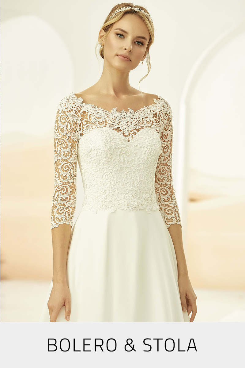 Zur Kategorie Brautbolero und Brautstola Braut in einem Langarm-Brautbolero aus Vintage-Spitze und U-Ausschnitt